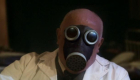 Dr Constantine mid-transformation into a gas mask zombie