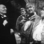 cherub holds polly at gunpoint while doc and ben watch