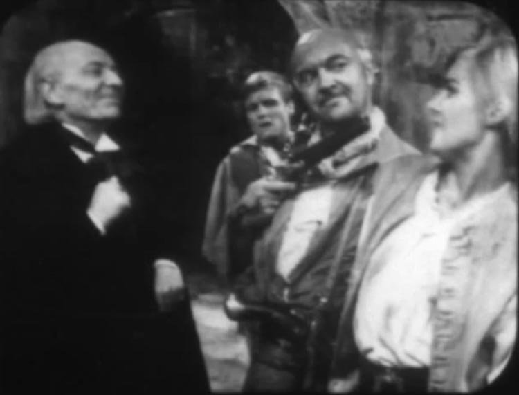 cherub holds polly at gunpoint while doc and ben watch