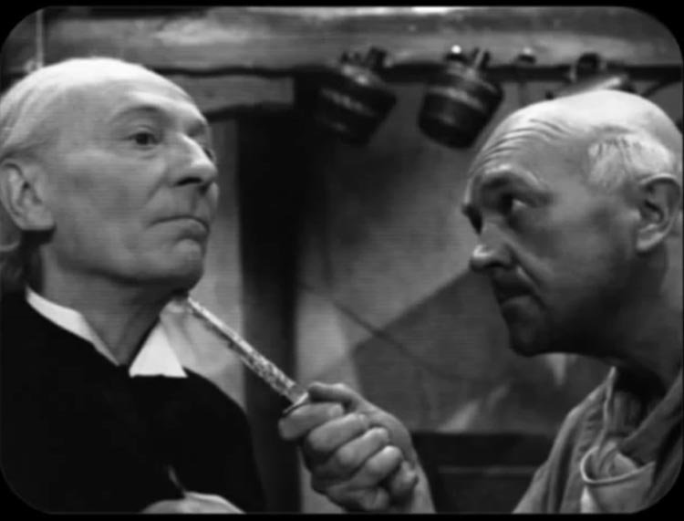 cherub threatens doc with a knife