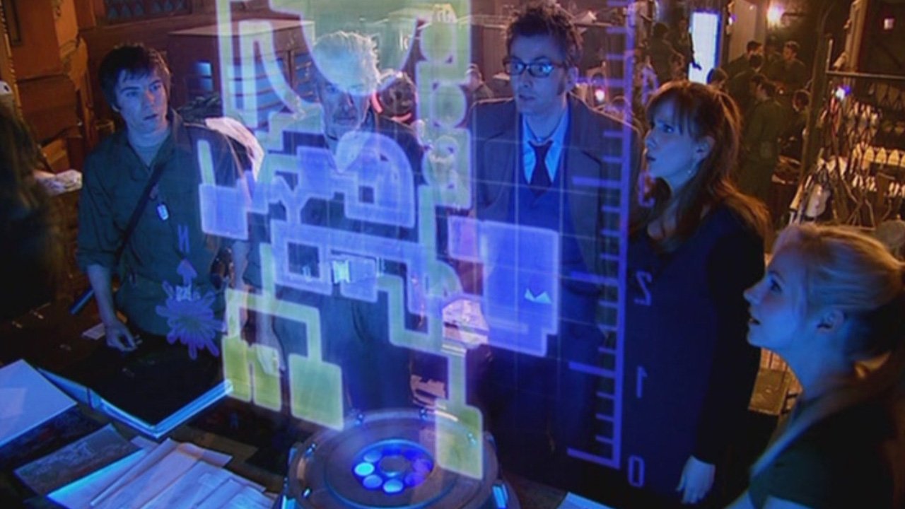 doc-donna-jenny-and-general-whatshisface-stare-at-a-holographic-map-the-doctor's-daughter-dr-who-back-when