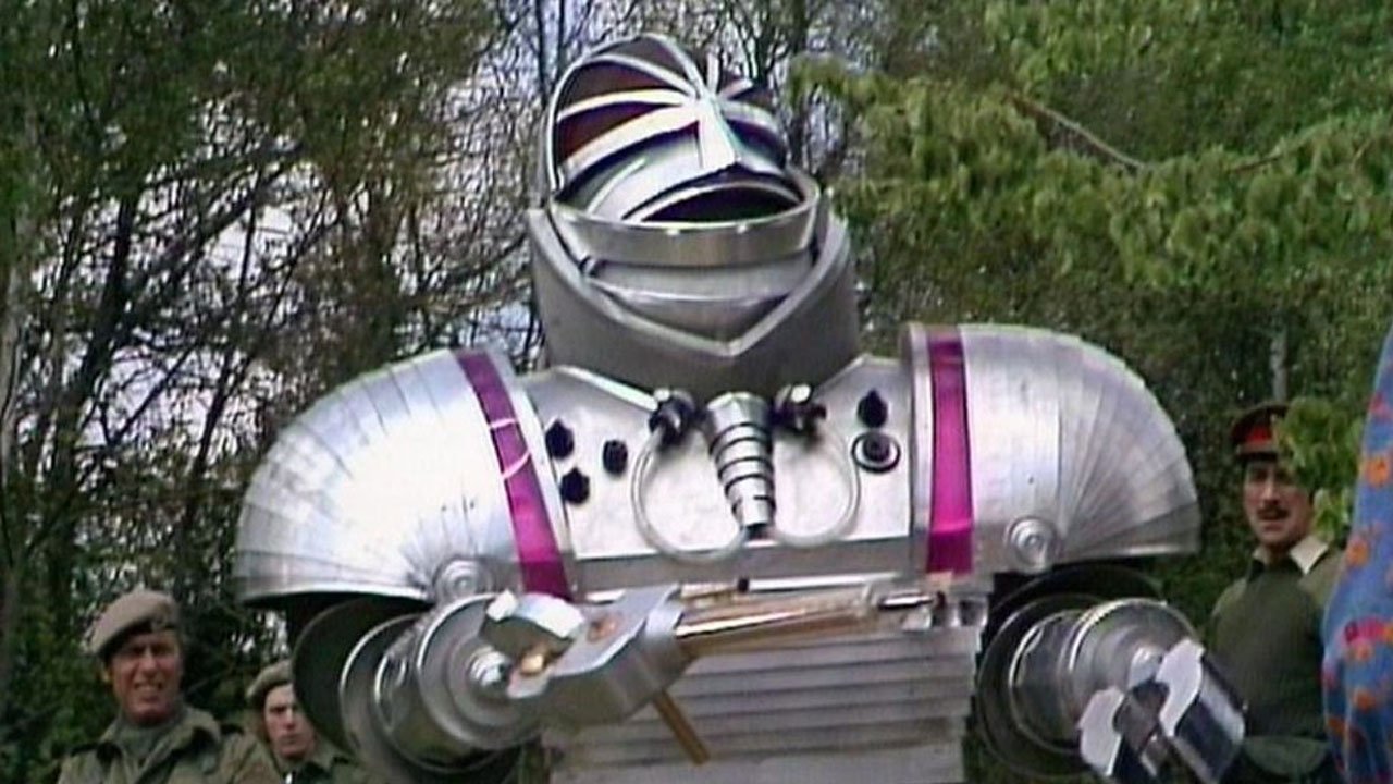 large-k1-with-bagels-brigadier-benton-and-standard-unit-dudes-in-background-robot-tom-baker-doctor-who-back-when