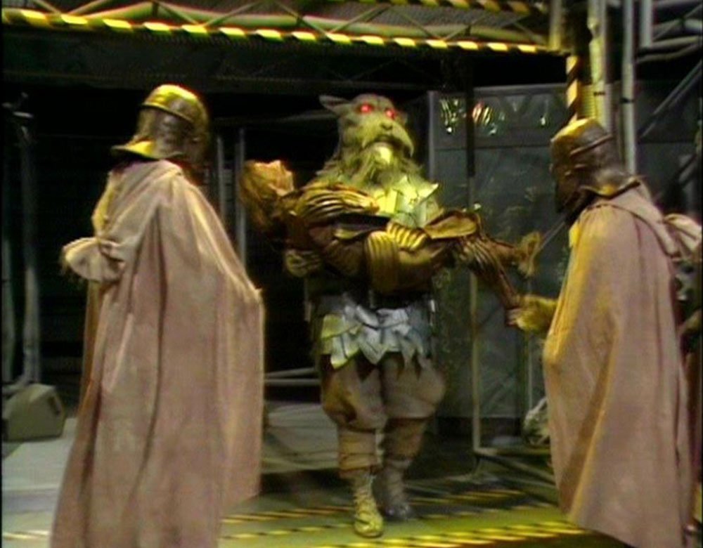 the-garm-carries-guard-out-of-forbidden-zone-terminus-doctor-who-back-when