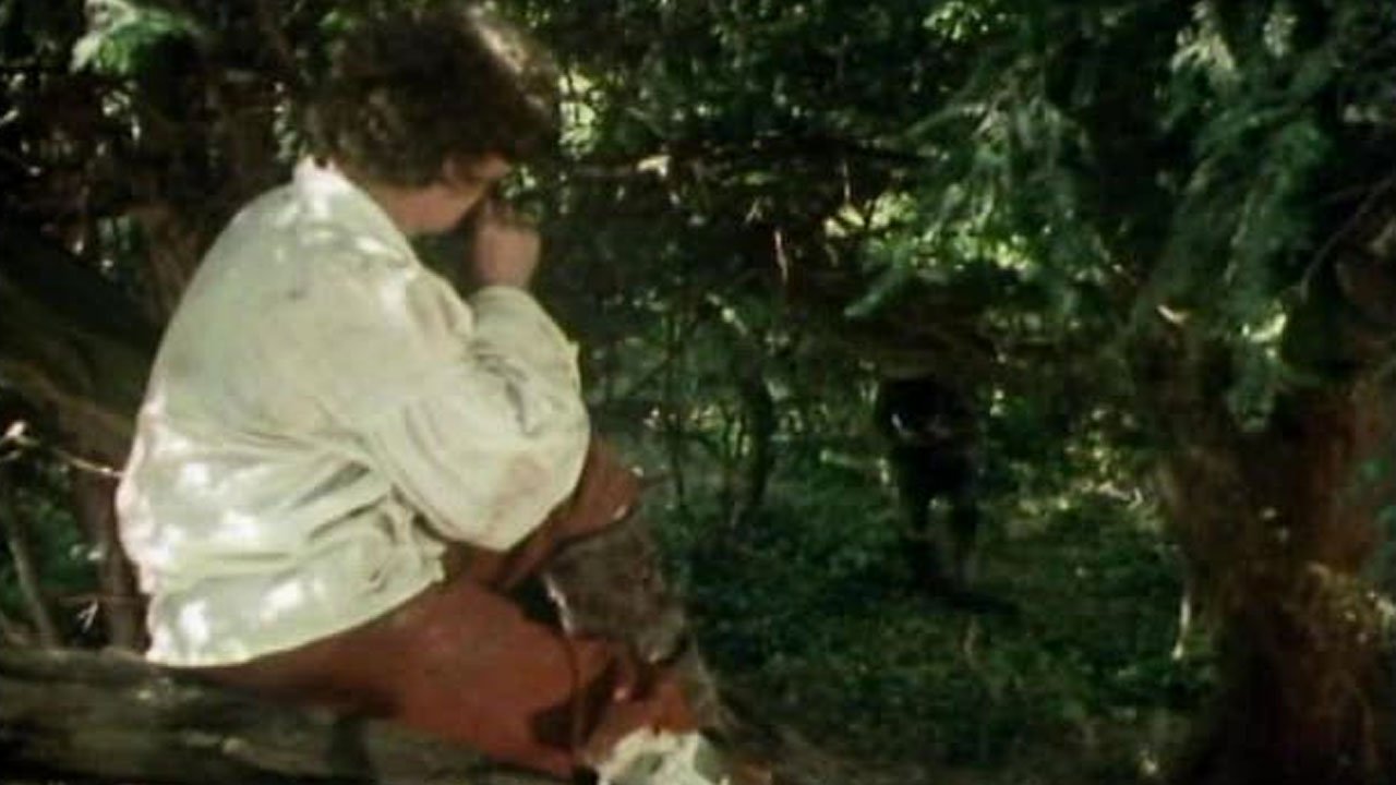 tom-baker-blows-a-dart-at-chancellor-goth-deadly-assassin-doctor-who-back-when