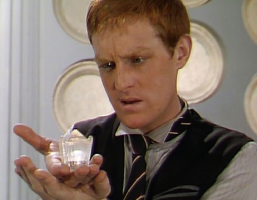 turlough-looks-at-his-crystal-thingy-terminus-doctor-who-back-when