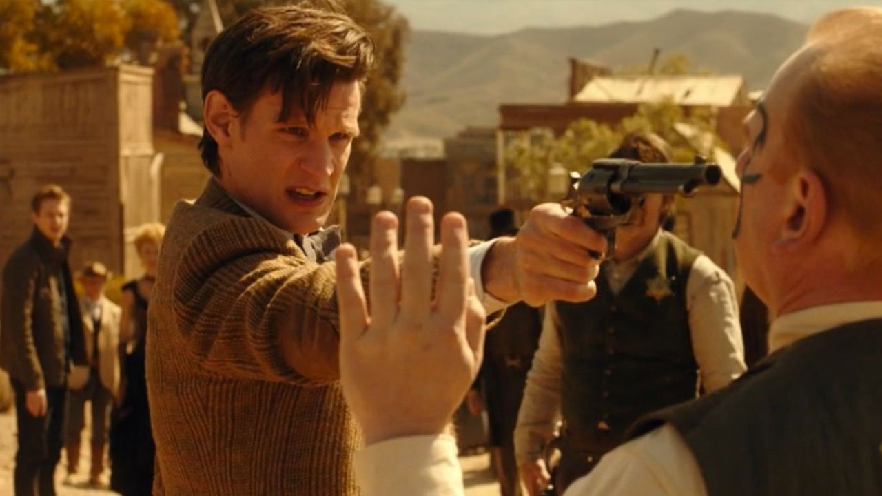 war-criminal-doc-points-gun-at-different-war-criminal-doc-town-called-mercy-doctor-who-back-when